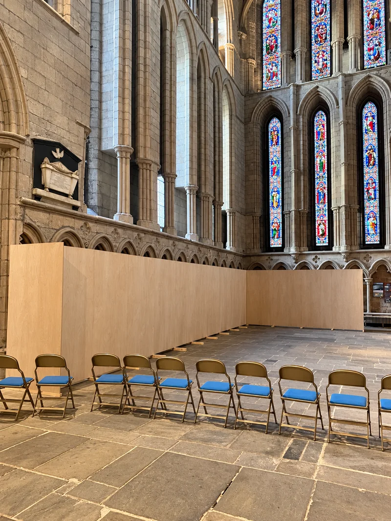 Timber art-installation screening inside Hexham Abbey; photo enhanced