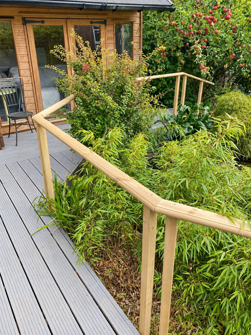 Timber handrail alongside garden decking; photo enhanced